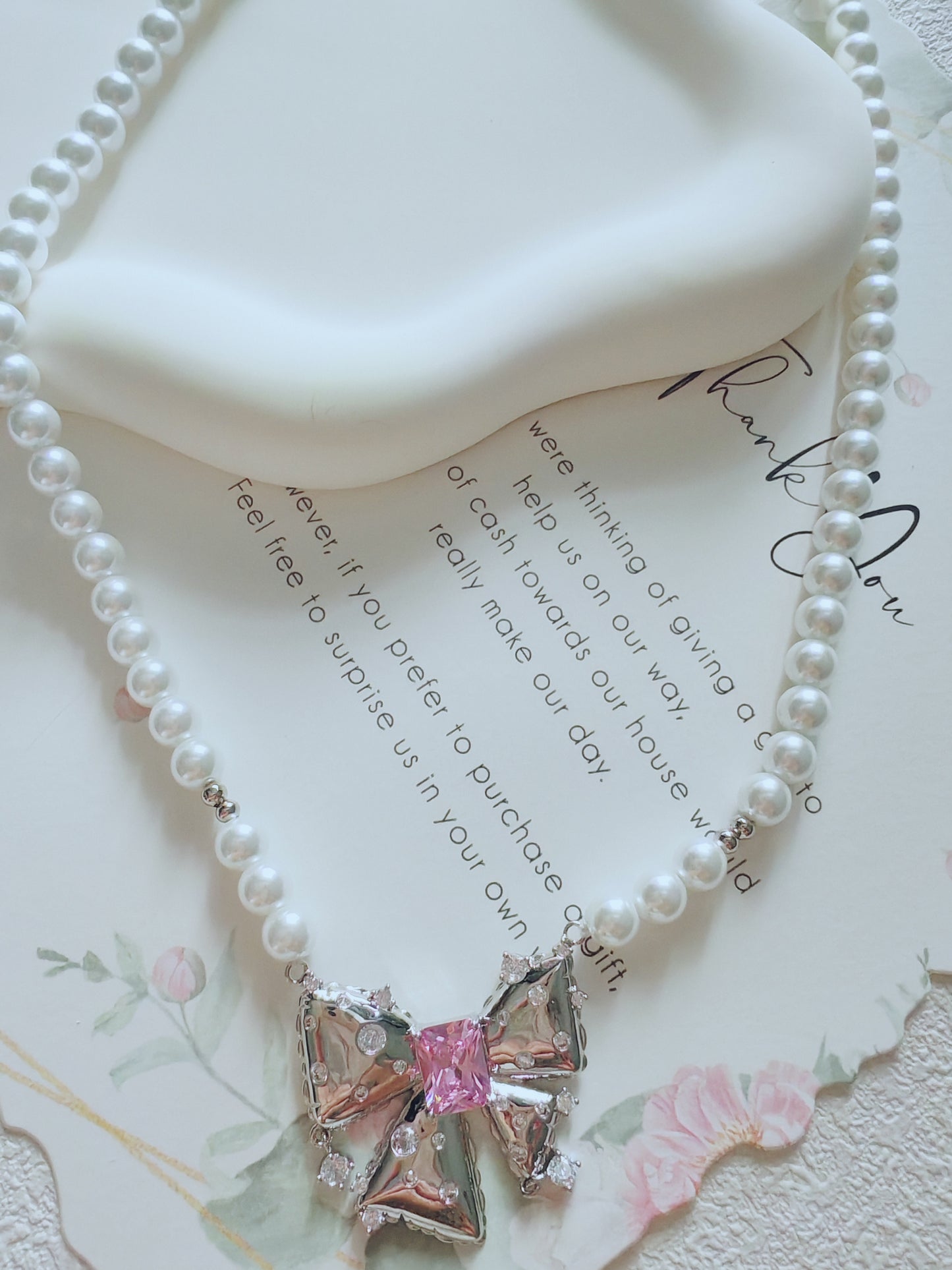 Elegant Pearl Bow Necklace with Pink Crystal Center
