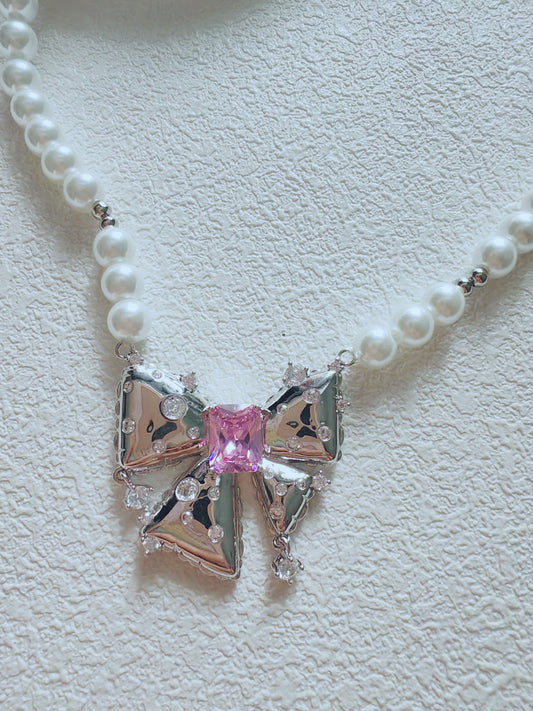 Elegant Pearl Bow Necklace with Pink Crystal Center