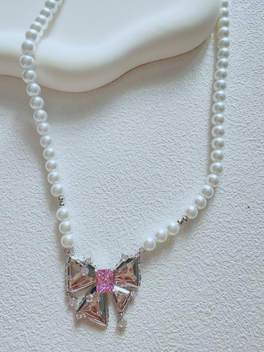 Elegant Pearl Bow Necklace with Pink Crystal Center