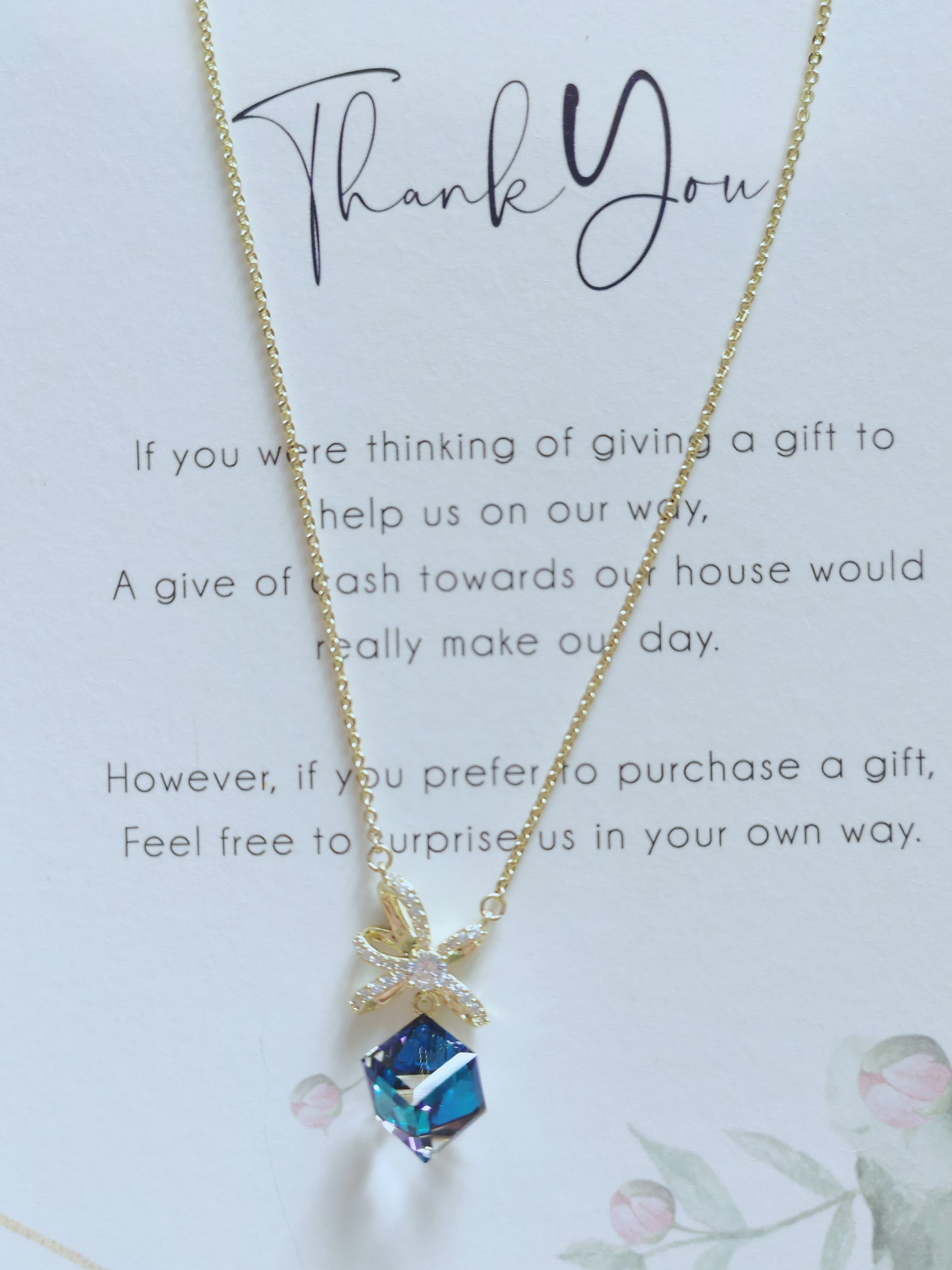 Radiant Blue Crystal Pendant Necklace – Elegant Gold Bow Design